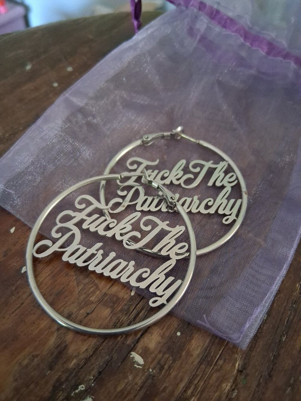 Earrings Topple and Burn silver hoops